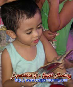 cute filipino toddler reading